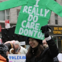 green jacket shaped sign I Really Do Care