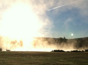 Sun shrouded in lake mist shortly after sunrise.