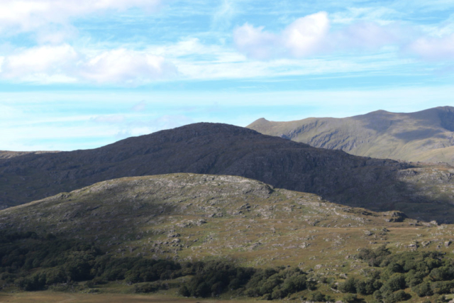 rugged mountainsides DIngle pensula blue skies white clouds