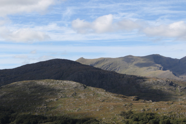 rolling and layered mountainsides DIngle pensula blue skies