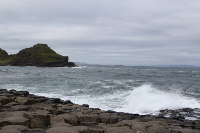 Giants Causeway, roiling surf at edge of vast ocean