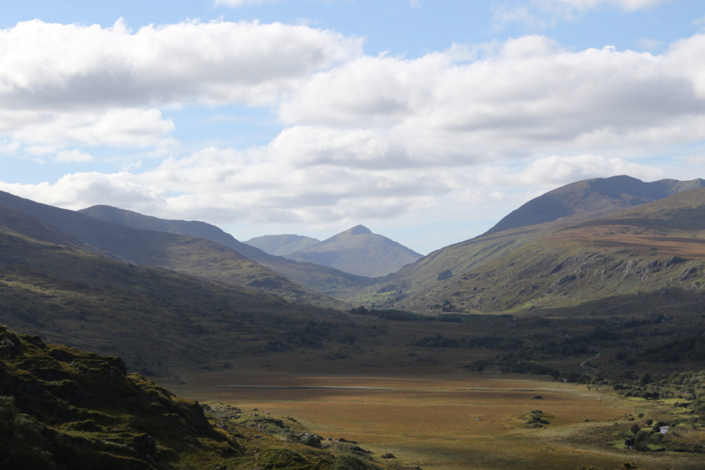 valley and shadows of mountains Dingle Peninsula blue skies white clouds