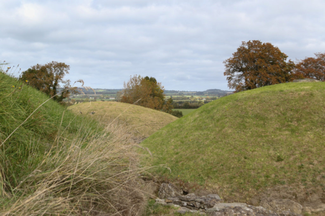 Tomb mounds in foreground overlooking valley