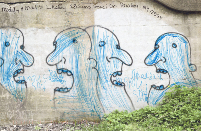 four talking heads street art, inked blue wiht words between their mouths