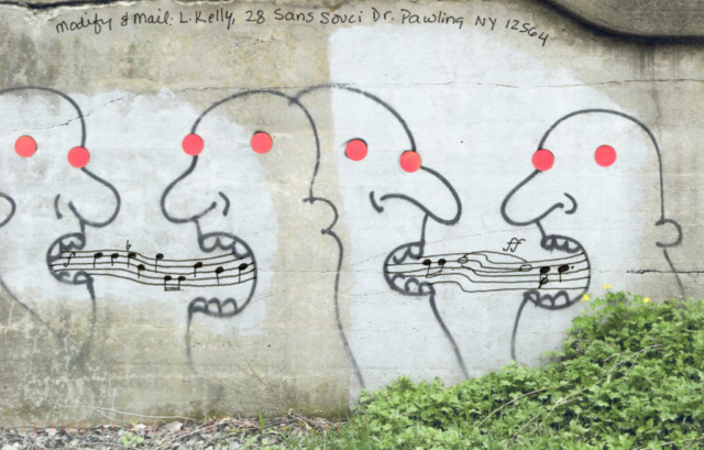 street art with four heads postcard musical notes and scales between faces, orange dot eyes