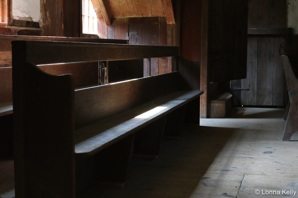 Quaker Meeting House light from window on benches 