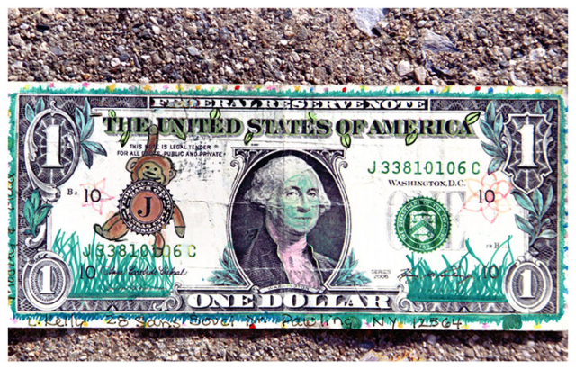 dollar bill with Monkey hanging from with seal of treasury as chest green leaves and grass