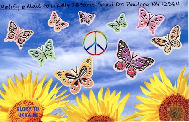 colorful butterflies and peace sign pasted  in blue sky over yellow sunflowers
