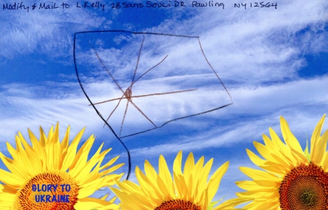 crayon drawing of outline of flag with star  in blue sky over yellow sunflowers