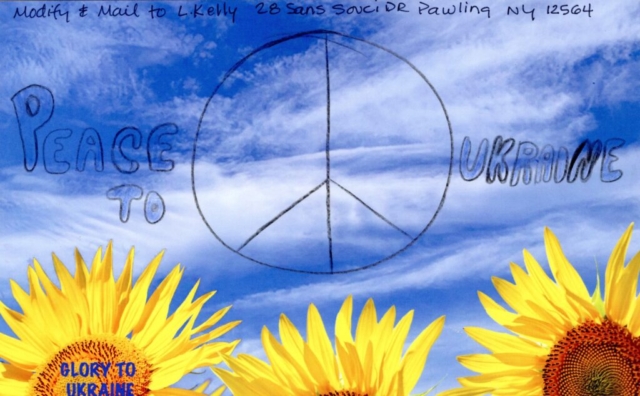 text peace to Ukriane and peace sign  in blue sky over yellow sunflowers