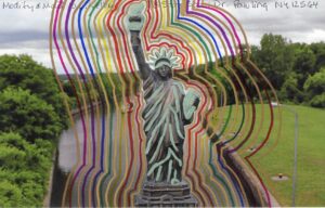 multiple colorful lines make outline on replica Statue of Liberty positioned on Erie Canal Lock background