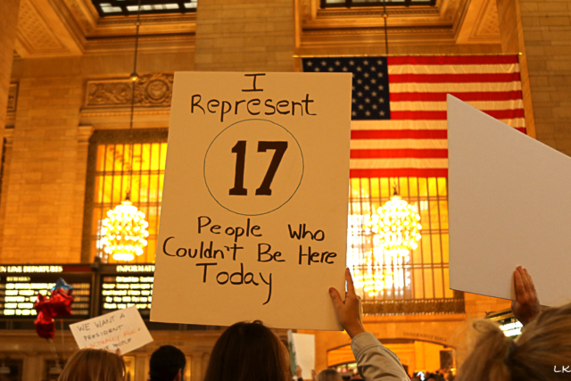 Grand Central Station protest sign I represent 17 people who couldn't be here today