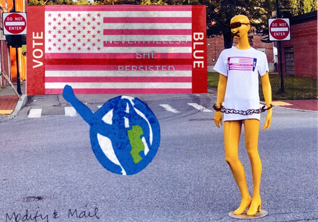 Mannequin with blind fold and hands chained with pink flag nevertheless she presisted.